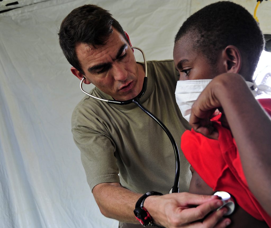 French navy emergency practitioner Lt. Cmdr. Christophe Bombert uses a stethoscope to examine a Papua New Guinean child at the Wampar medical civic action project during Pacific Partnership 2011 in Lae, Papua New Guinea, May 23, 2011. Pacific Partnership is an annual deployment of forces designed to strengthen maritime and humanitarian partnerships during disaster relief operations, while providing humanitarian, medical, dental and engineering assistance to nations of the Pacific. (U.S. Air Force photo by Tech. Sgt. Tony Tolley/Released)